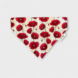 Close-up of orange poppy dog collar from SpringButiken in an urban setting