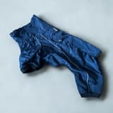 Tiaki Hund Overall: a dark blue dog overall with pale piping and leg openings.