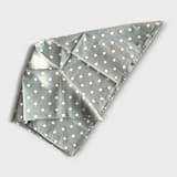Olive green polka dot dog scarf with white dots.