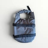 Blue camo dog life jacket seen from the side, showing the sturdy handle on the back for easy lifting.