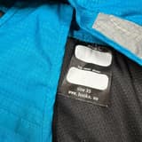 Light blue and grey Hööks dog raincoat, size 35 cm, keeps dogs dry.