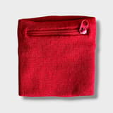 Mini wrist pocket for dog treats in bright red with closed zipper, worn on the wrist