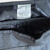 Dog wearing second-hand Active Canis reflective raincoat 45 cm, black visible. Pet apparel for increased safety in dark.