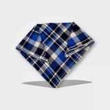 Second-hand dog bandana with Nordic plaid pattern in white and brown, shown flat.