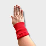 Red mini dog treat pouch for wrist, ideal for training and walks.
