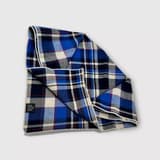 Close-up of a pre-owned Nordic plaid dog bandana made from recycled cotton, ideal for spring and autumn.