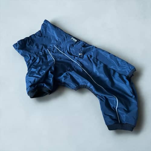 Tiaki Hund Overall: a dark blue dog overall with pale piping and leg openings.
