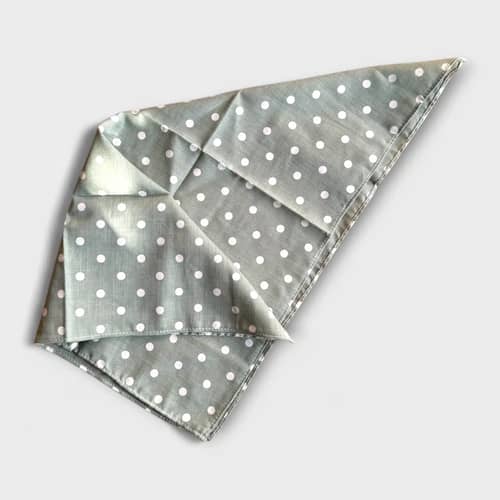 Olive green polka dot dog scarf with white dots.