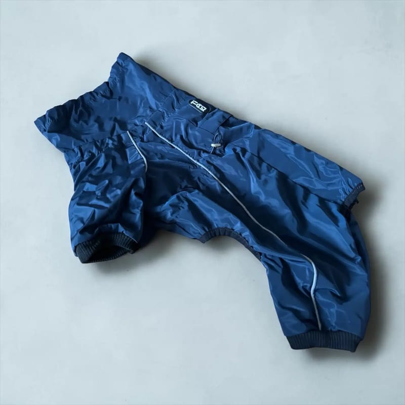 Tiaki Hund Overall: a dark blue dog overall with pale piping and leg openings.